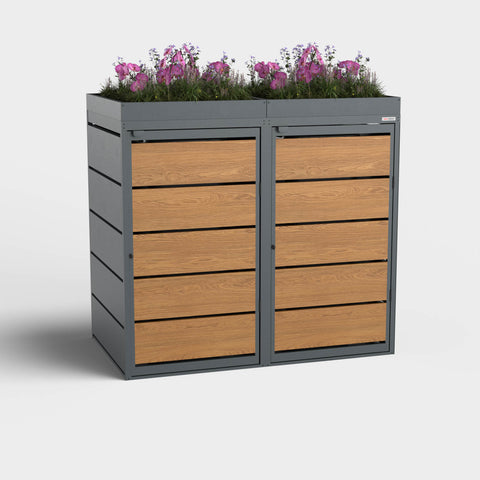 Dagobert box pour poubelles 2 bacs 240L en chêne doré avec toit végétalisé.